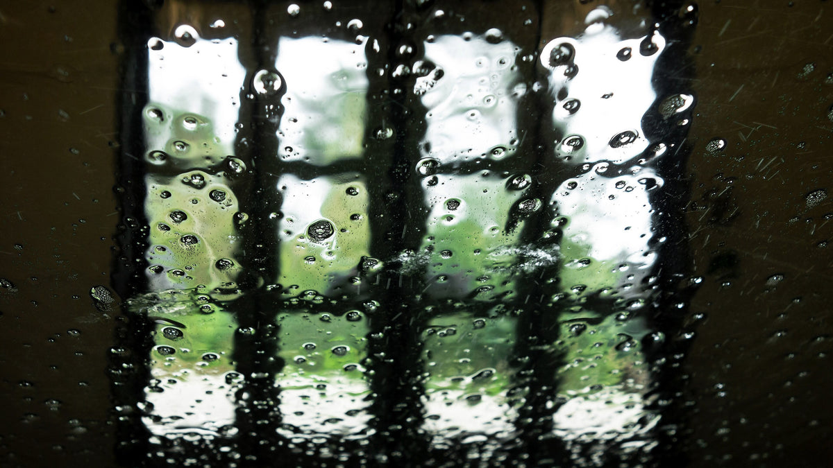 View through a wet windscreen inside an automatic car wash