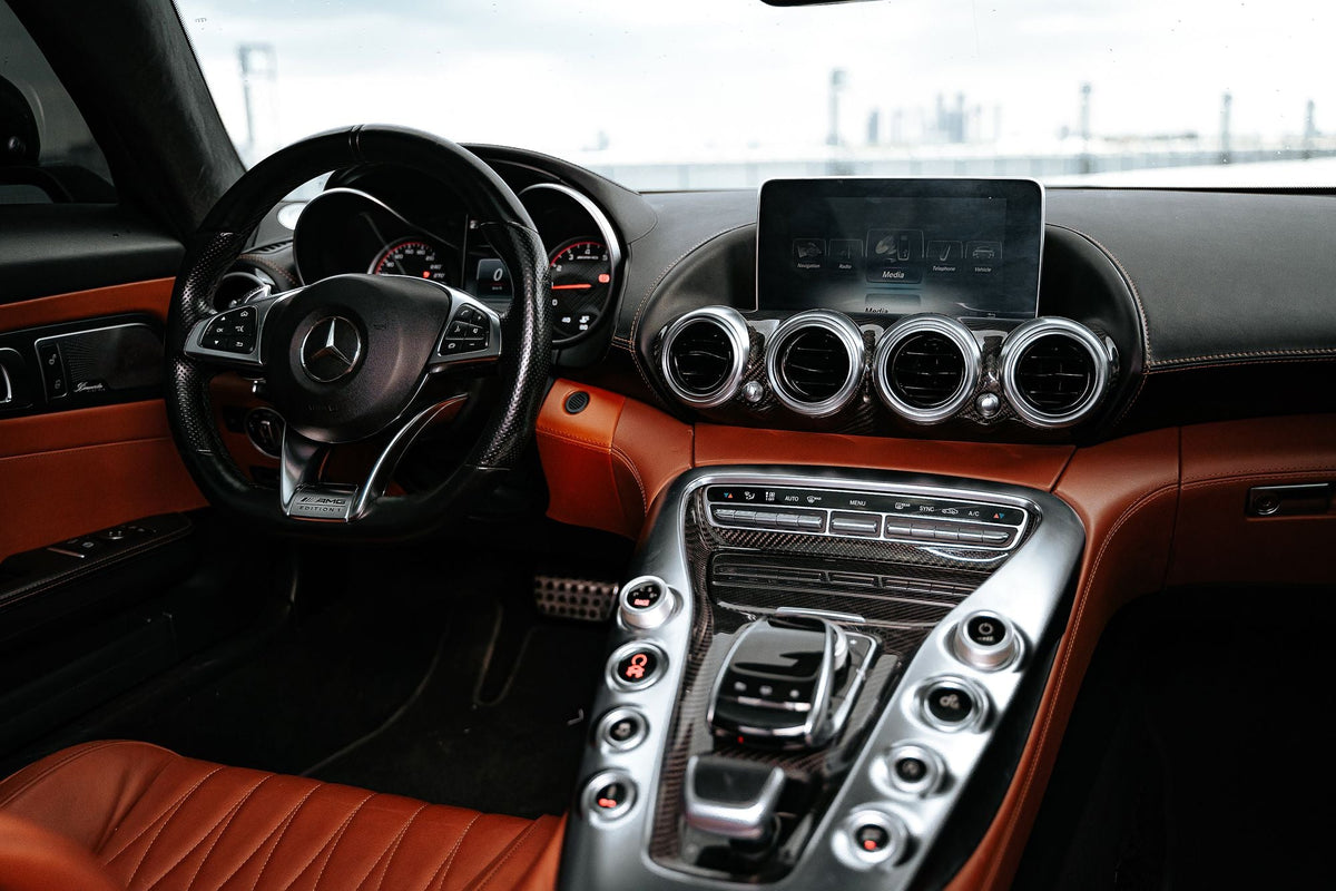 Clean car interior with leather seats and dashboard