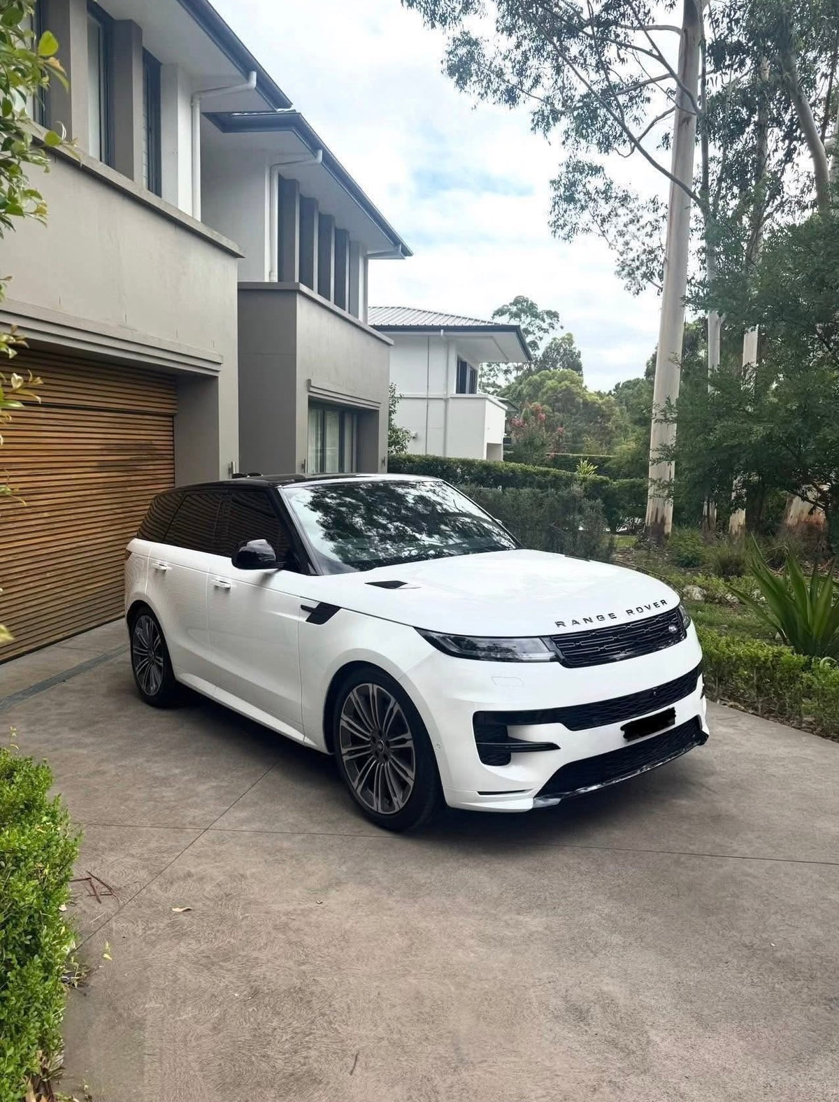White Range Rover Sport on a North Shore driveway after a STIKKYS detail